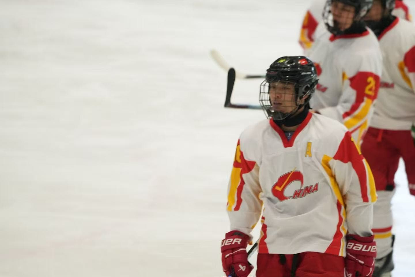 Frank on the ice in a white hockey jersey