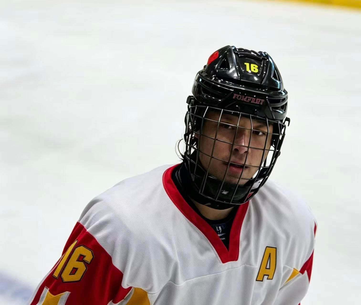 Frank on the ice in a white hockey jersey